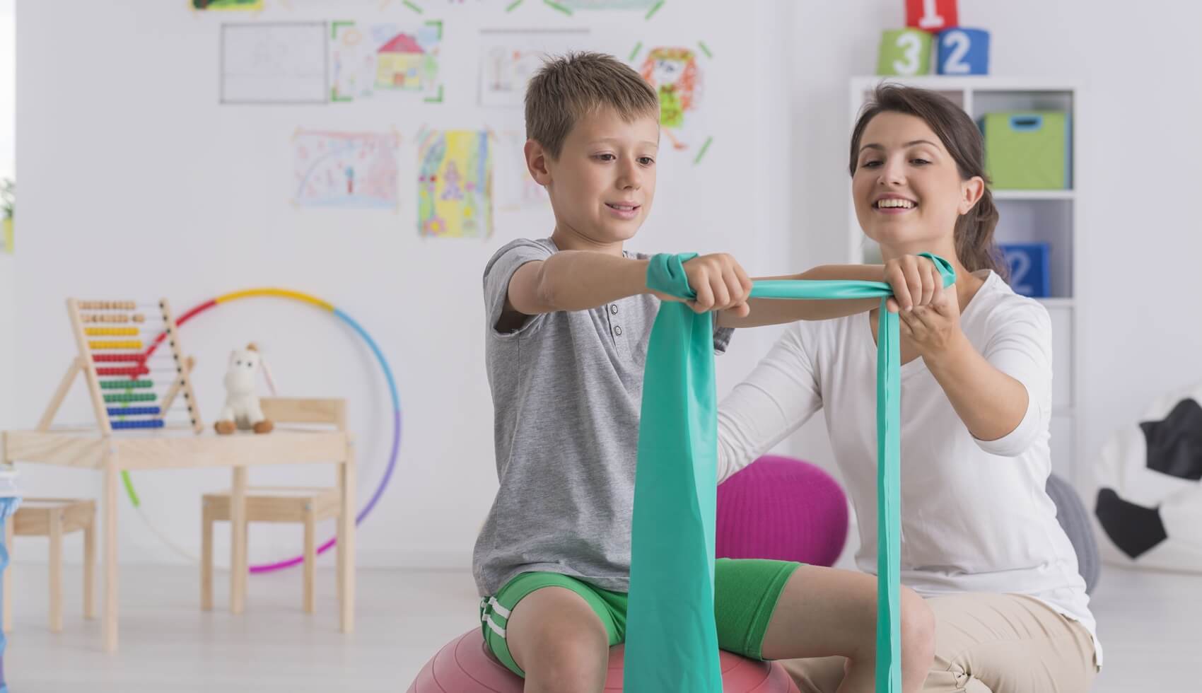 Pediatric physical therapist working with a student at school